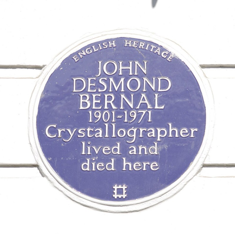 John Desmond Bernal photographed in a dark jacket, looking to the left of the camera